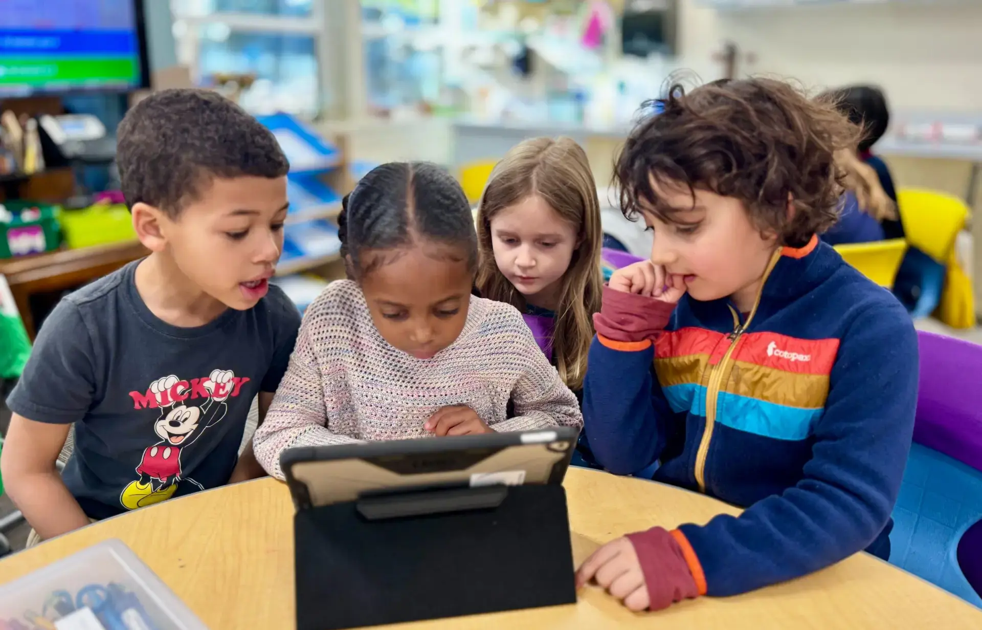 children working on tech project