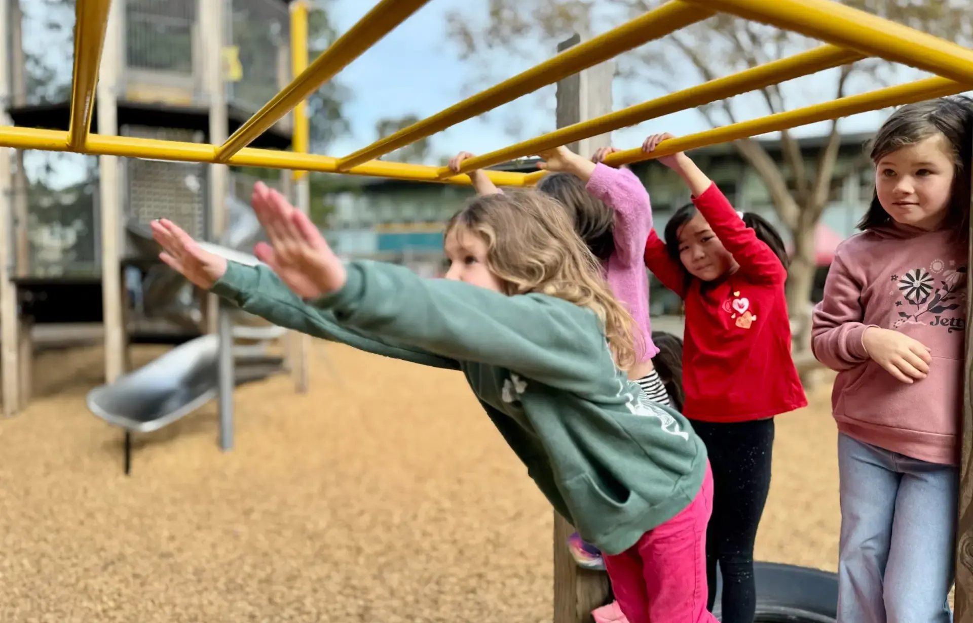 Girls on monkey bars
