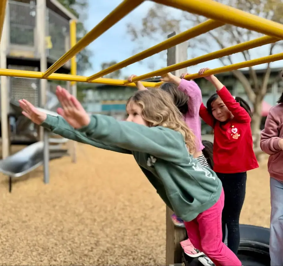 Four_LS_girls_on_monkey_bars