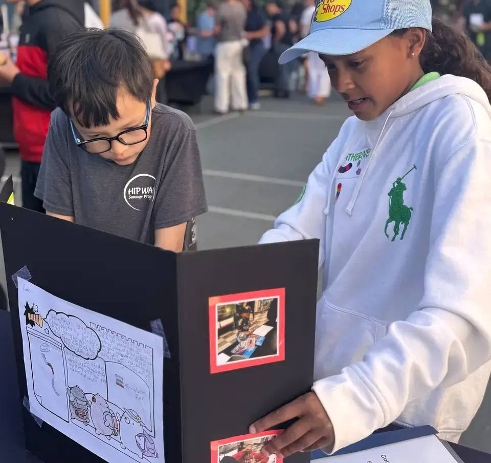 Girl_and_boy_viewing_presentation_at_SF