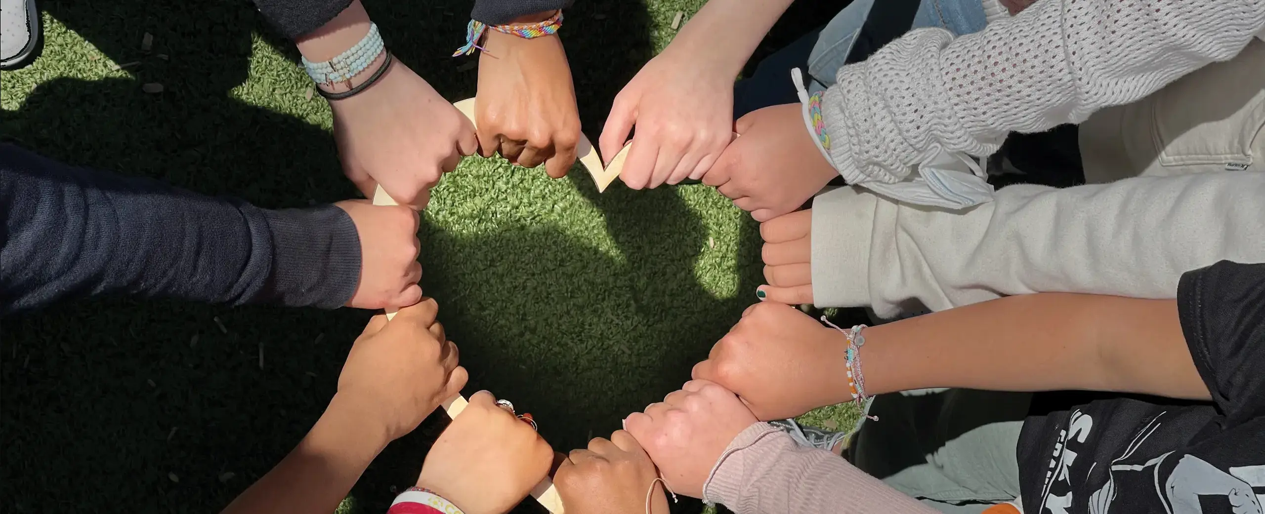 Hands together in shape of heart