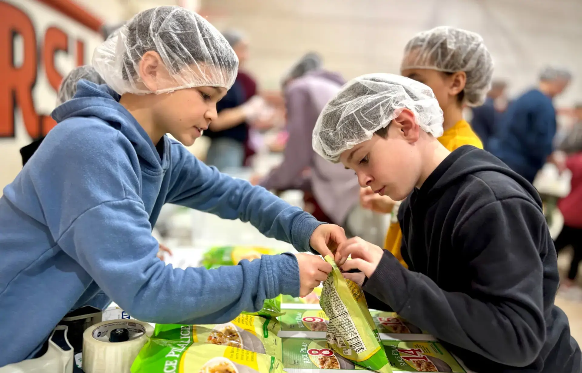 Two students meal packing