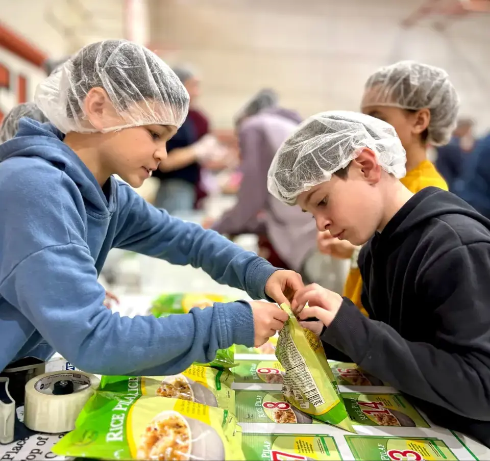 Meal_packing_two_students_working