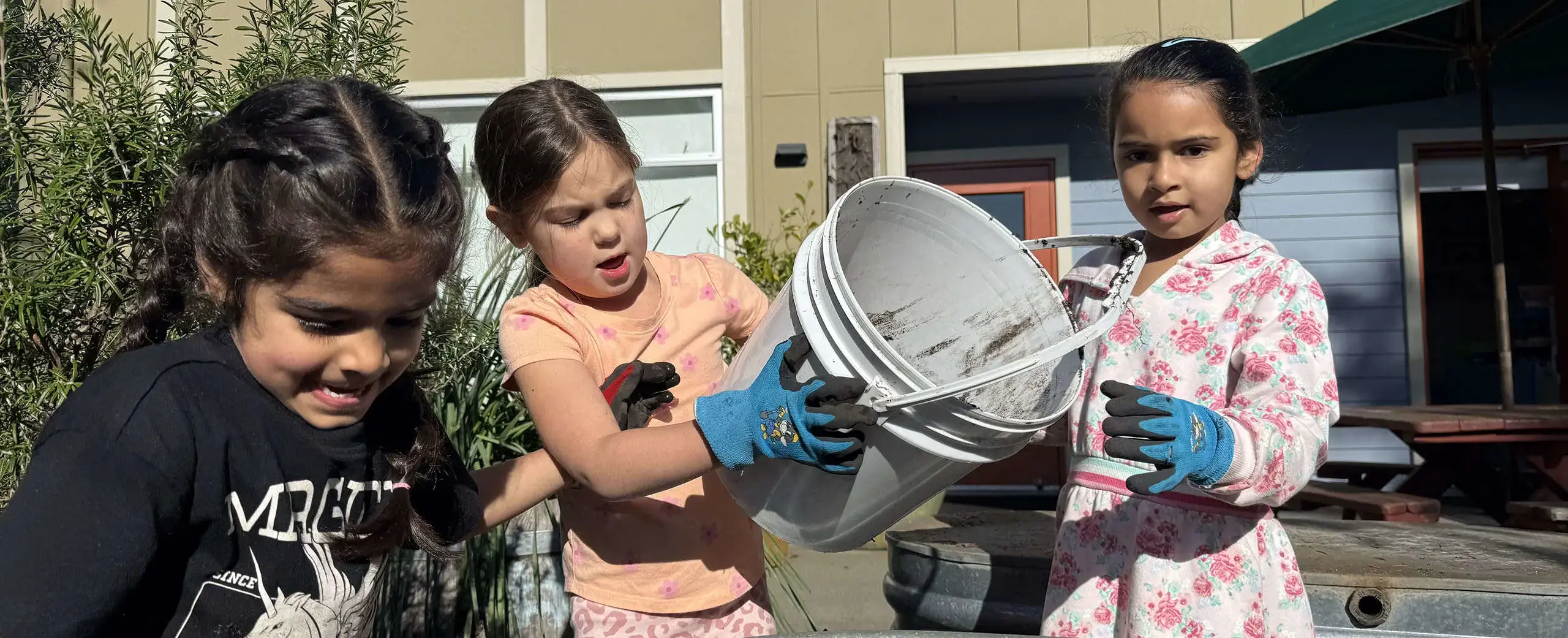 3 girls with bucket