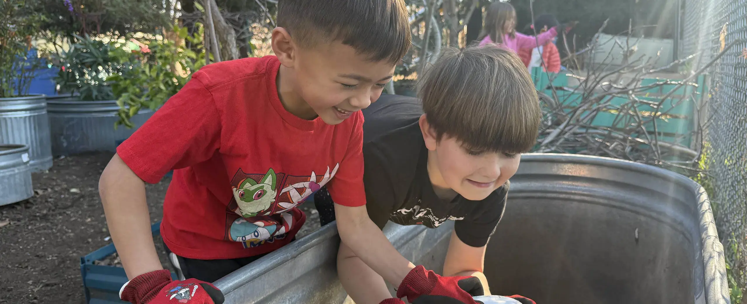 Two boys with bucket